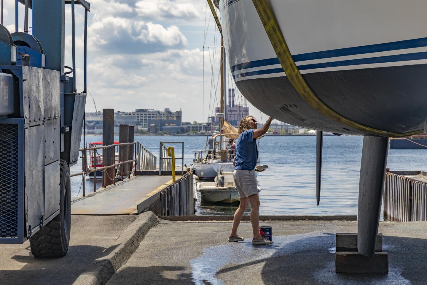 BHSM staff cleaning a boat