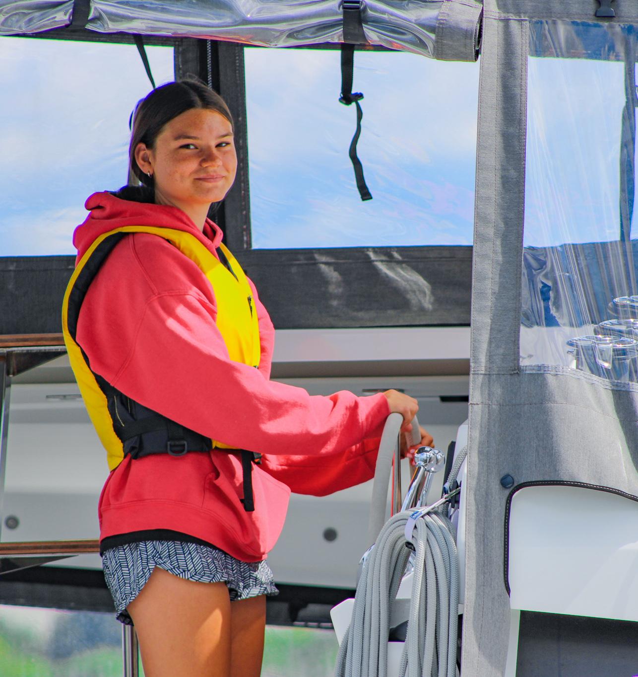 Piers Park Sailing student at the helm of a Sailtime catamaran