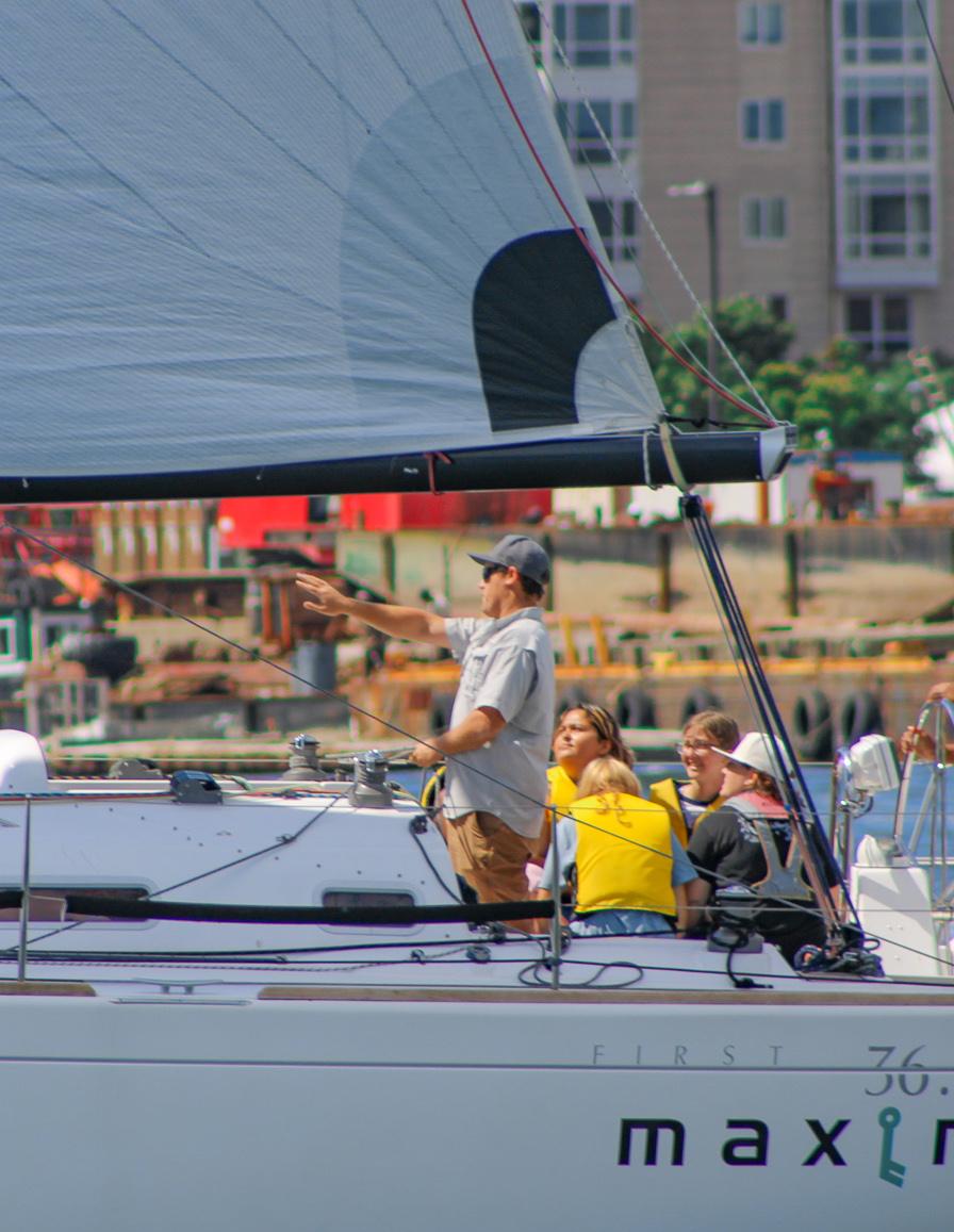 Forrest Hardy guiding a group of Piers Park Sailing Center students