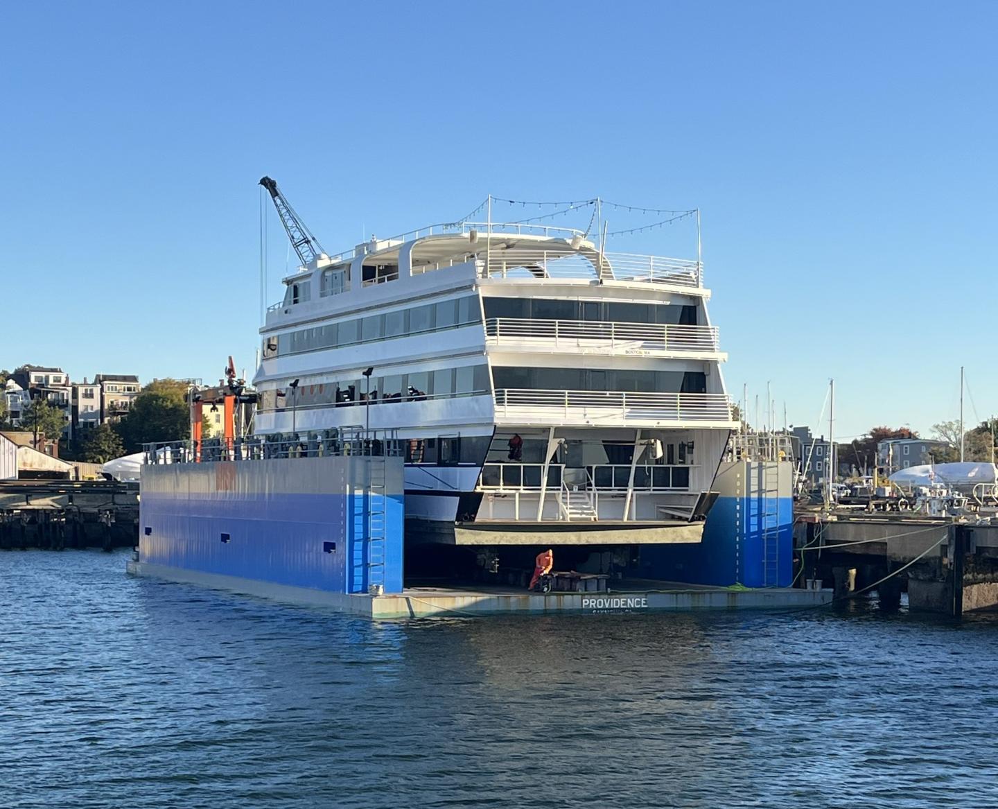 Floating dry dock at Boston Harbor Shipyard and Marina hauls vessel